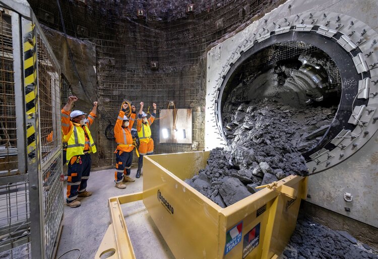 Photo of the team celebrating as mico tunnel boring machine Domenica breaks-through at Haycock Avenue