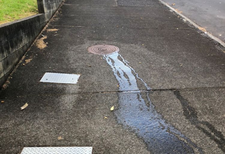 Manhole leaking on public property