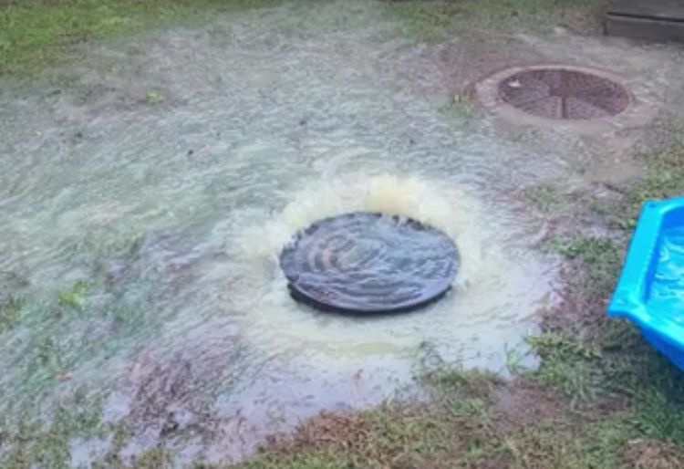 Manhole overflowing in a backyard